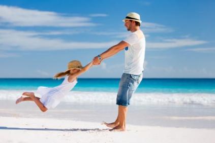 man on vacation playing with a child